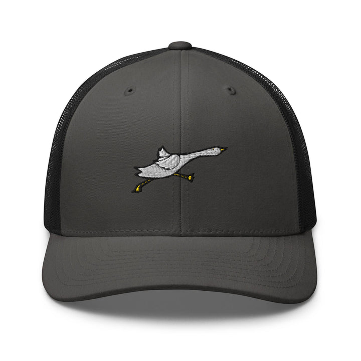 a gray and black trucker hat with a bird embroidered on the front