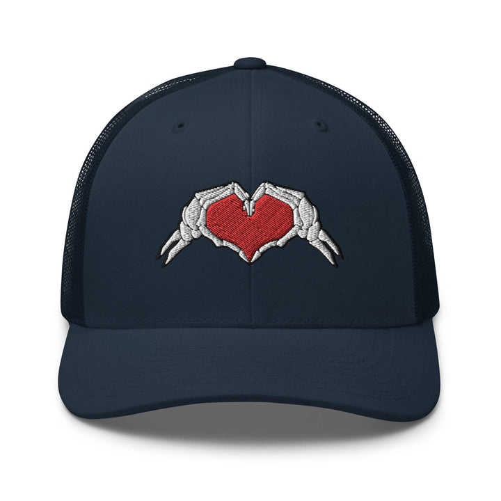a blue trucker hat with two hands holding a heart