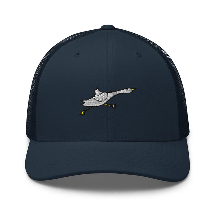 a blue trucker hat with an image of a duck flying through the air
