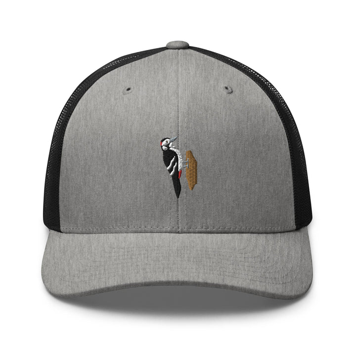 a gray and black hat with a picture of a bird on it