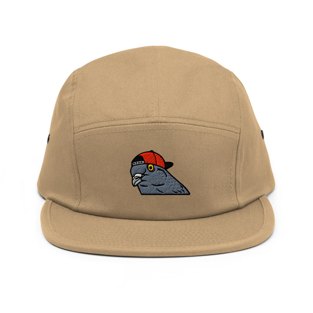 a tan hat with a bird embroidered on it