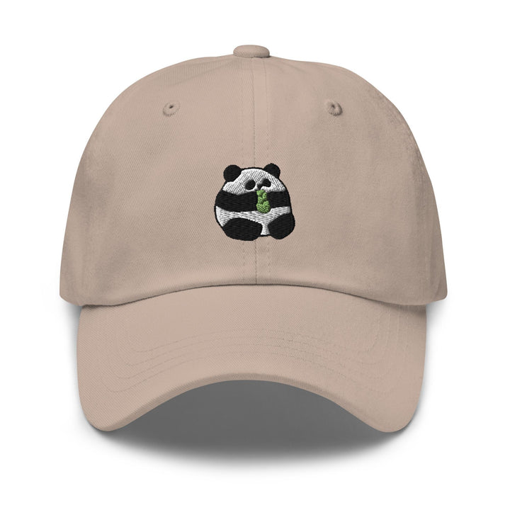a baseball cap with a panda eating a leaf