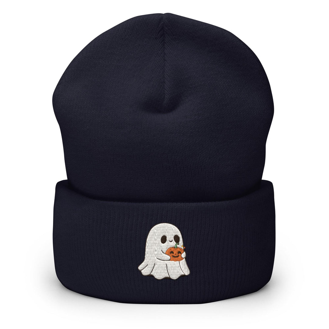 a beanie with a ghost holding a pumpkin