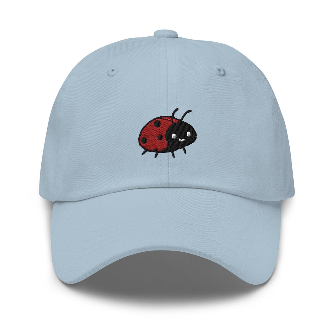 a light blue hat with a ladybug embroidered on the front