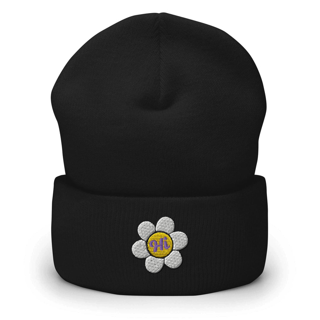 a black beanie with a flower on it