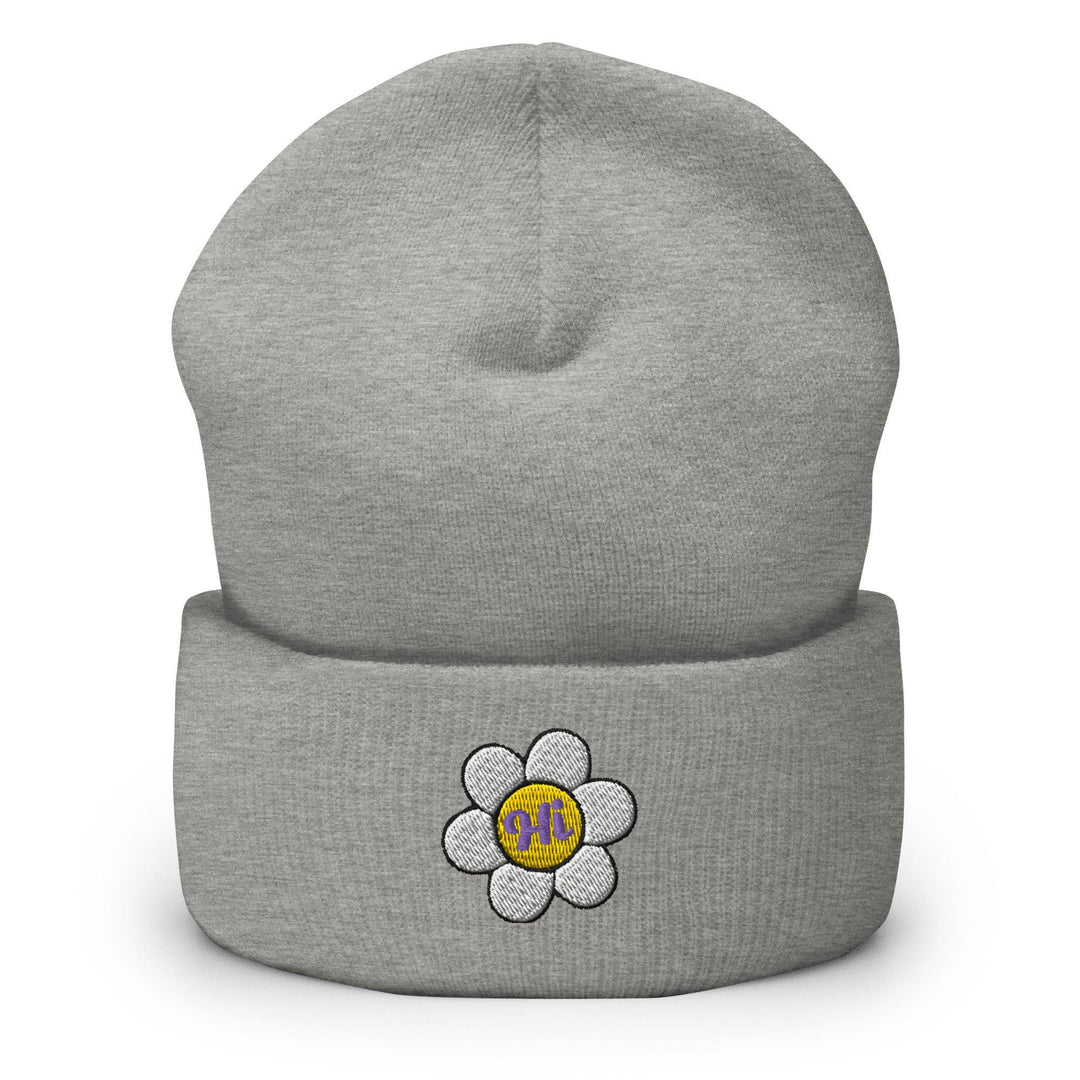 a gray beanie with a flower on it