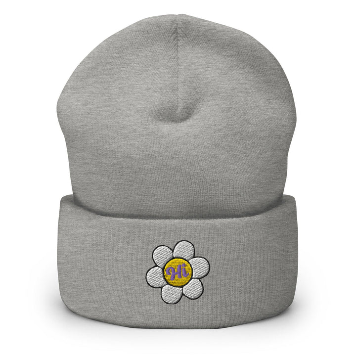 a gray beanie with a flower on it