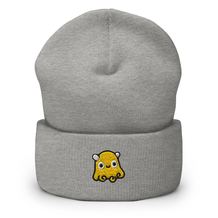 a gray beanie with a yellow and black cartoon character on it