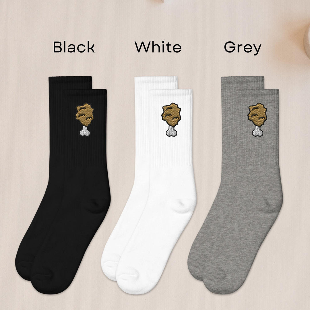 three pairs of black, white, and grey socks