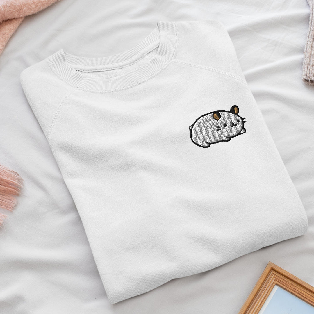 a white t - shirt with a picture of a cat on it