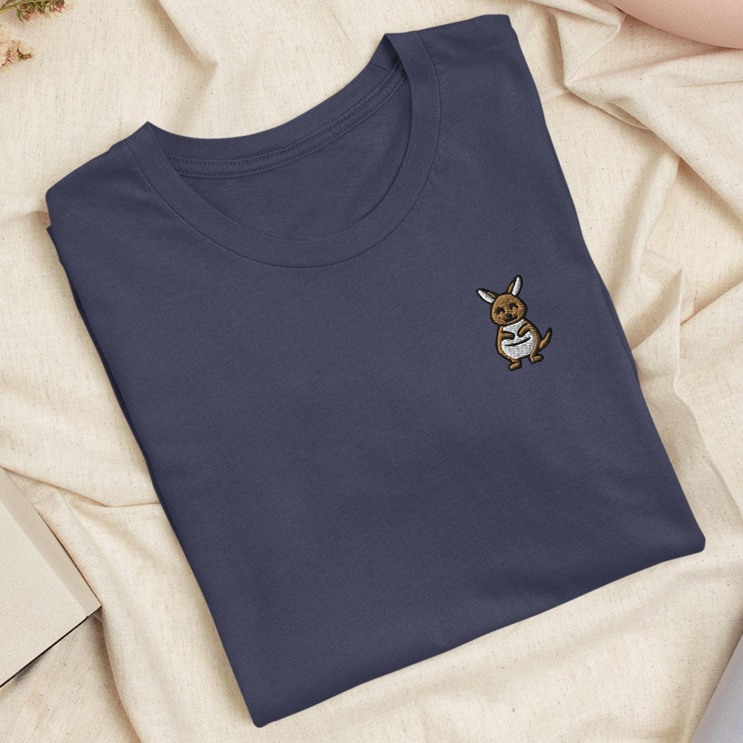 a blue t - shirt with a dog embroidered on it
