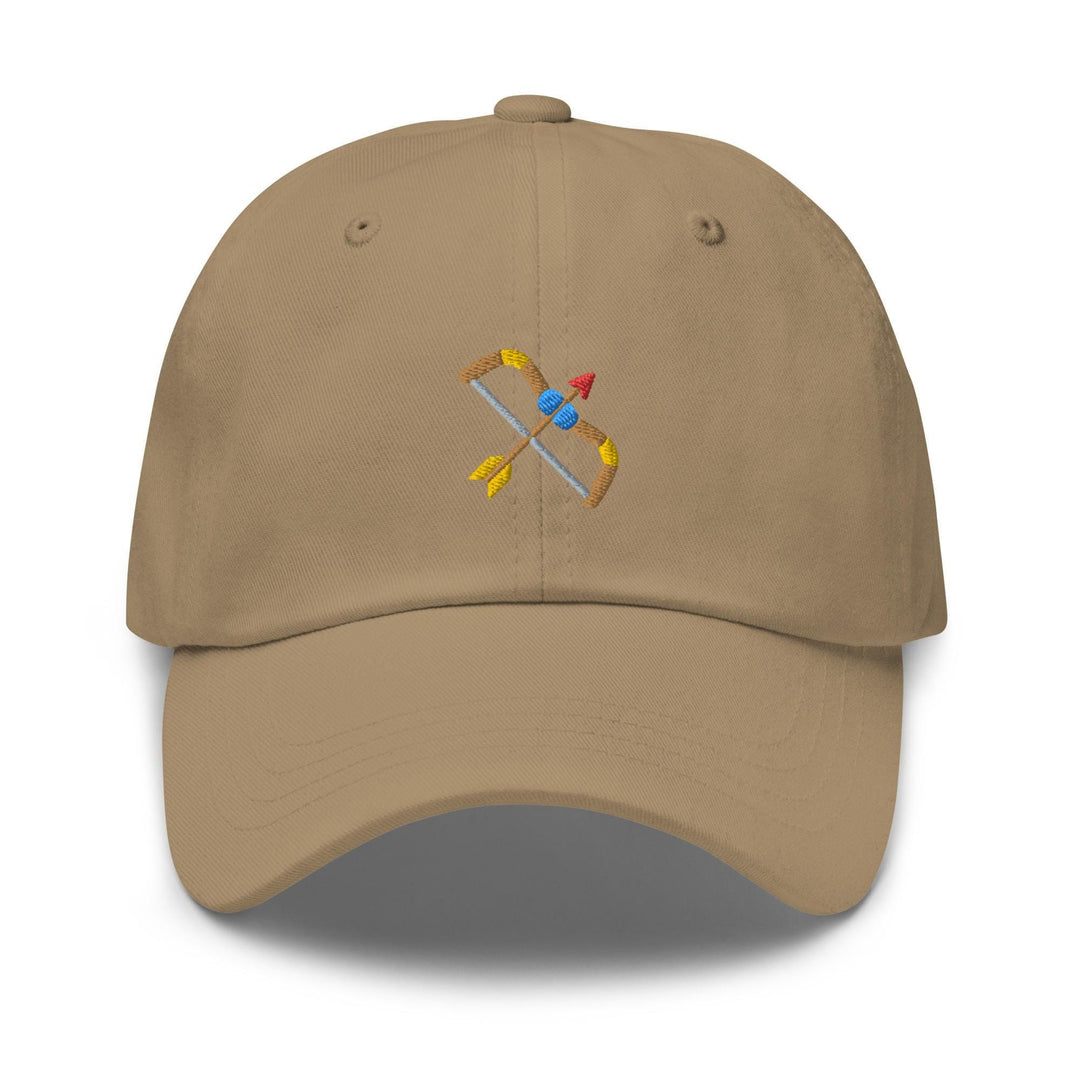 a tan hat with a plane embroidered on it
