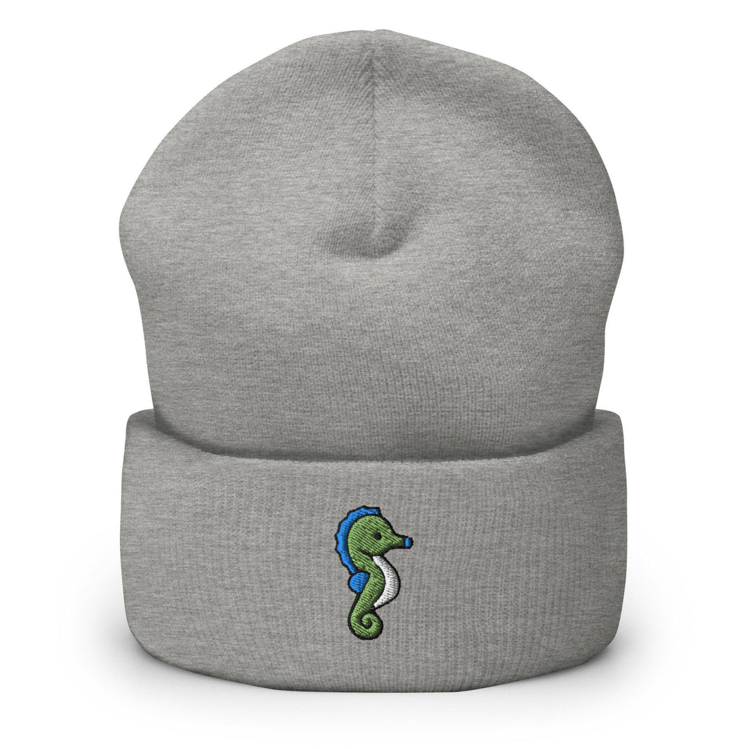 a gray beanie with a green seahorse on it