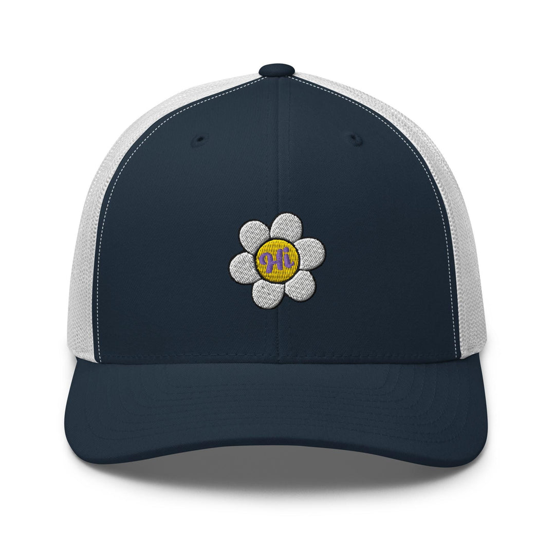 a blue and white trucker hat with a flower on the front