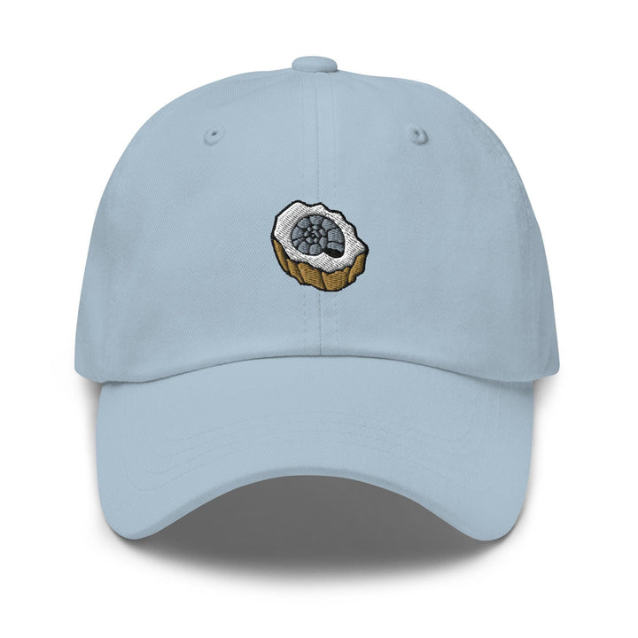 a light blue hat with a donut embroidered on it
