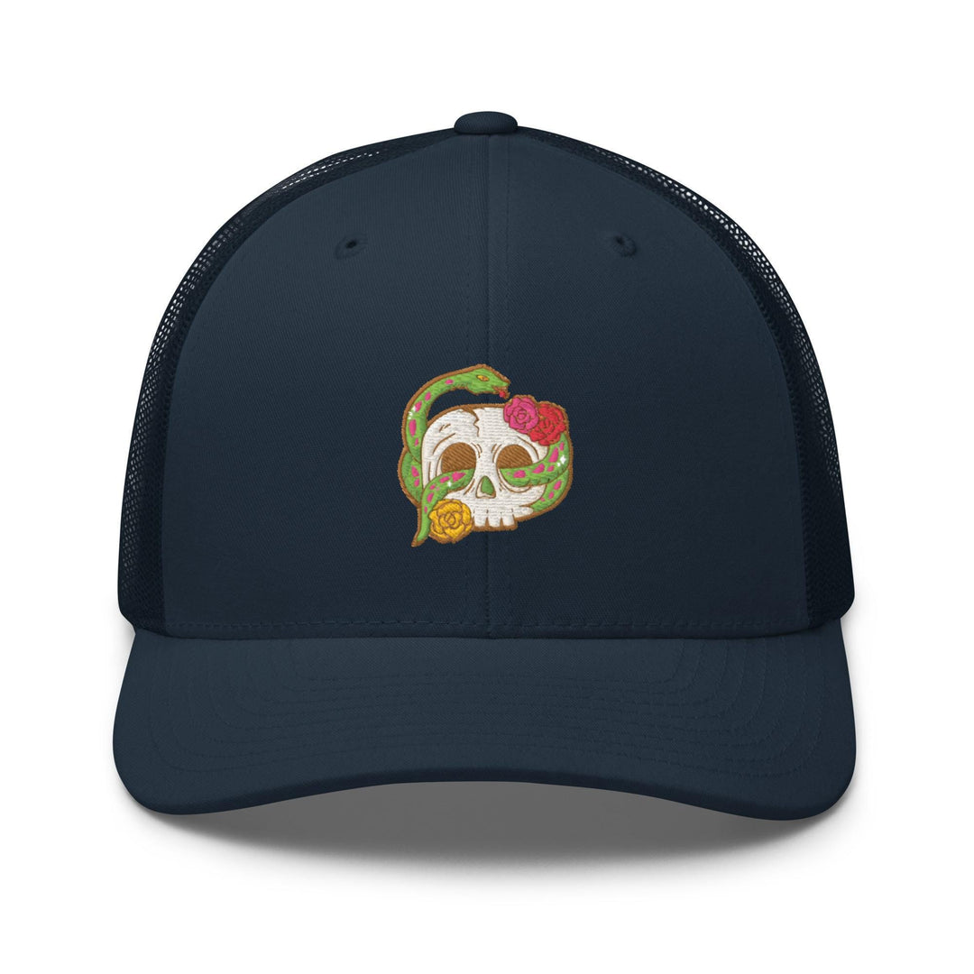 a blue trucker hat with a skull and a strawberry on it