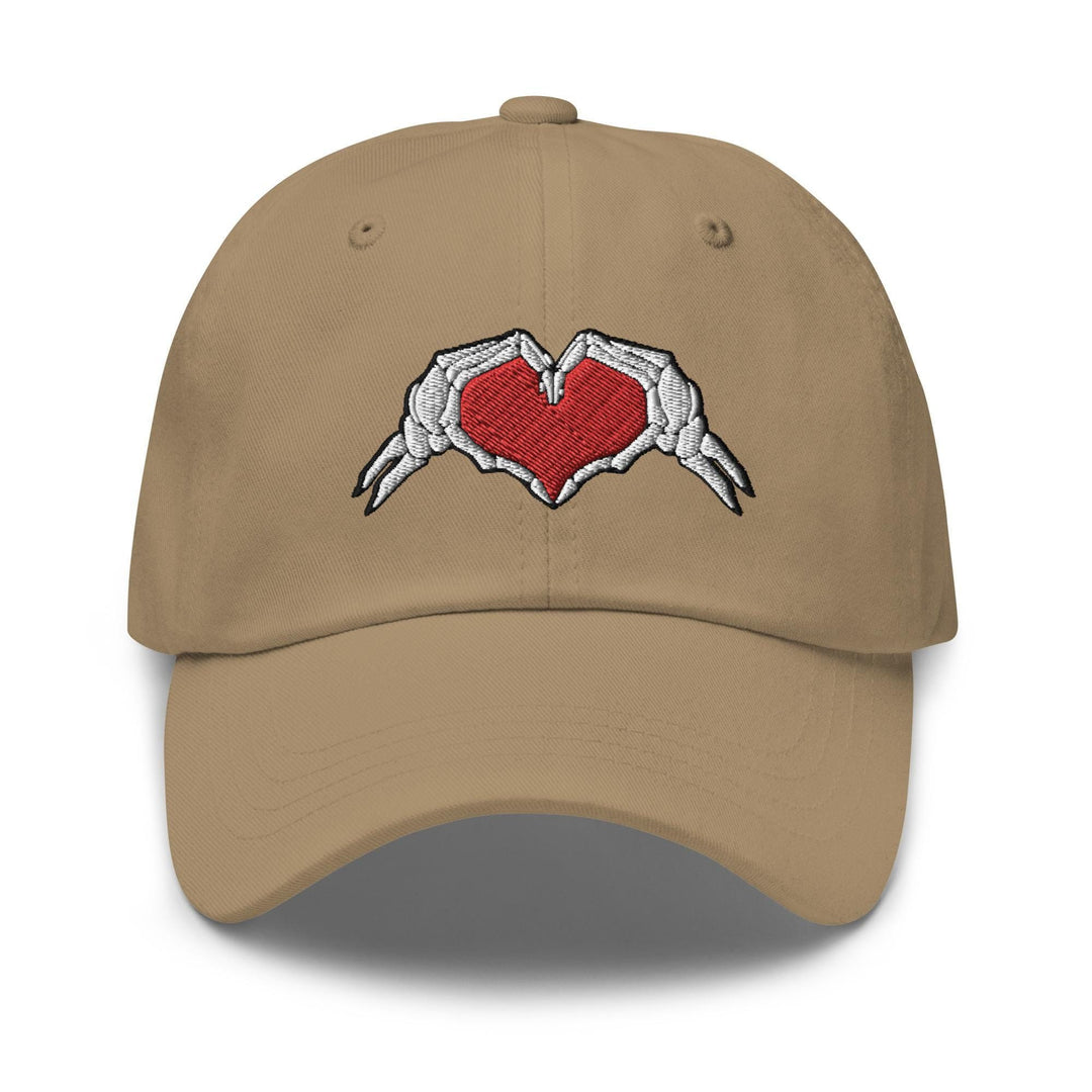 a baseball cap with a heart and two hands on it