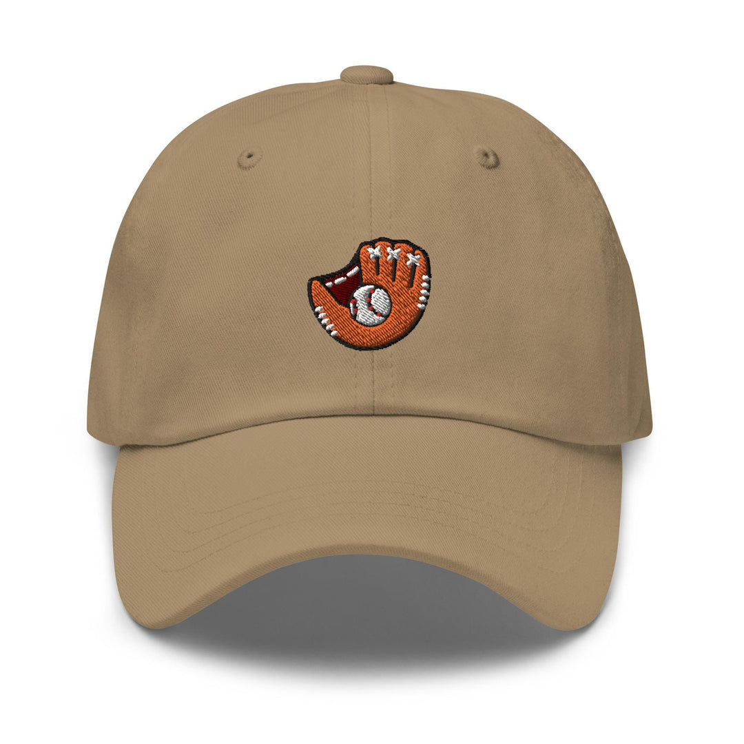 a baseball cap with a hand holding a ball