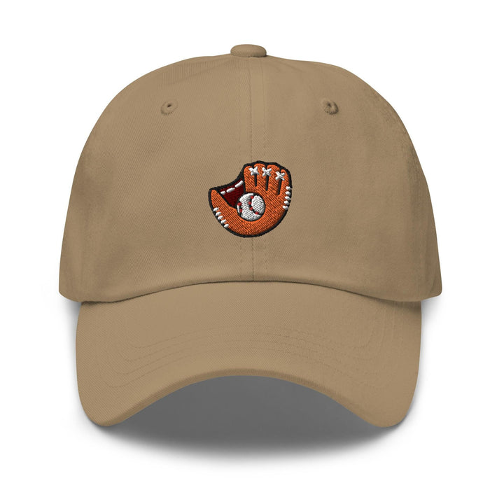 a baseball cap with a hand holding a ball