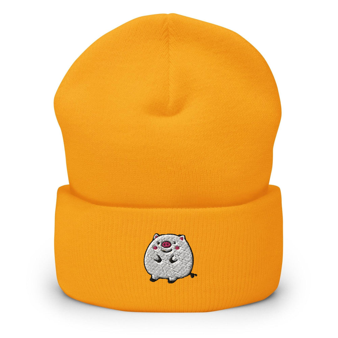 a yellow beanie with a white bear on it