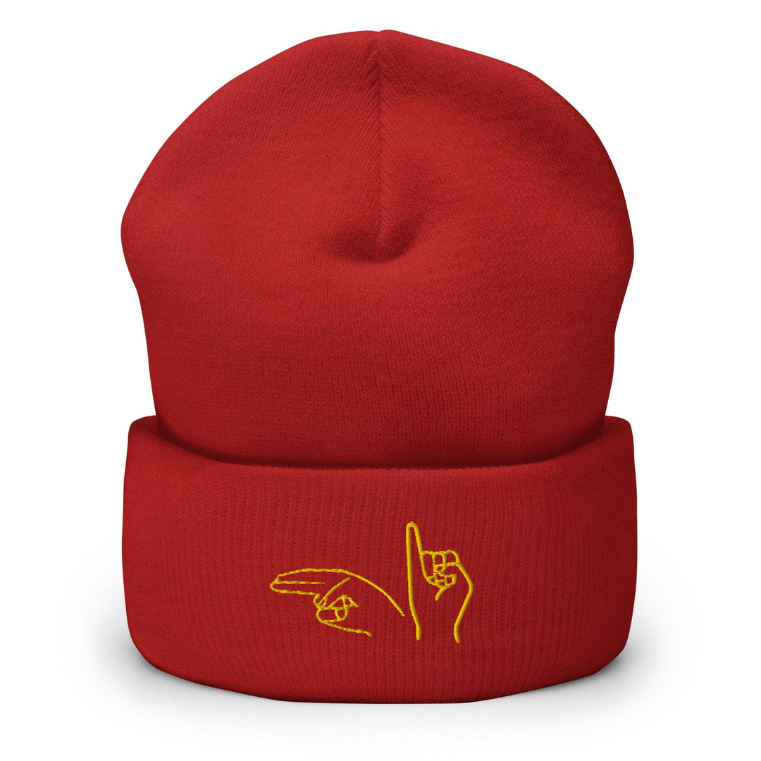 a red beanie with a yellow logo on it