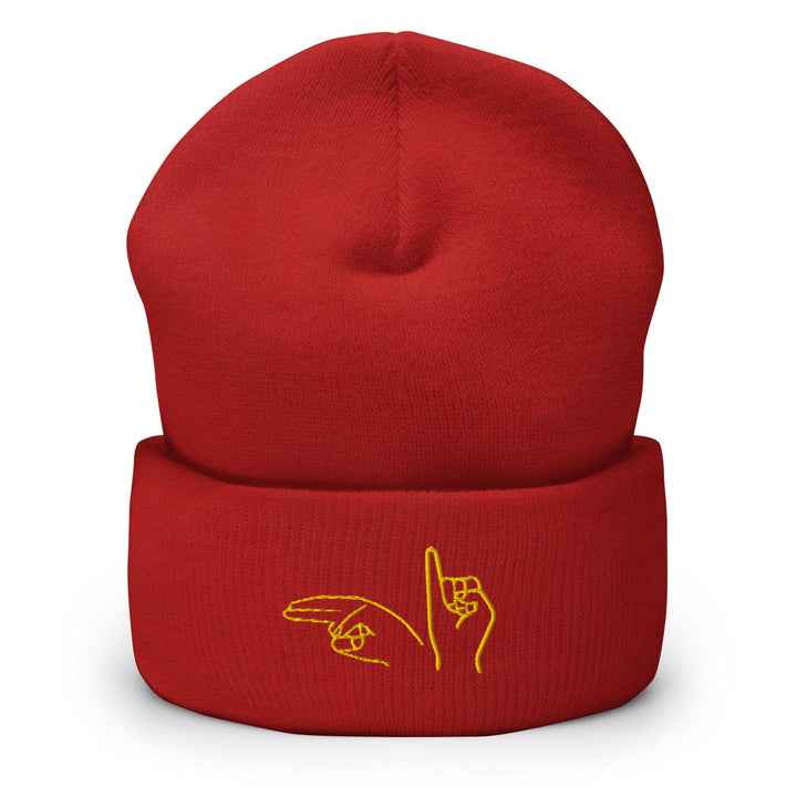 a red beanie with a yellow logo on it