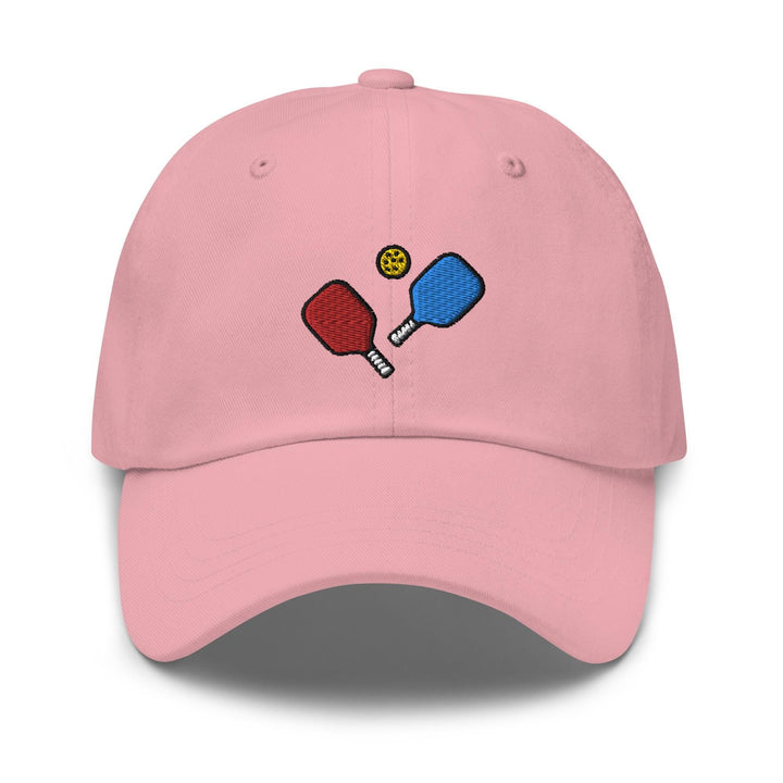 a pink hat with two ping pong paddles on it