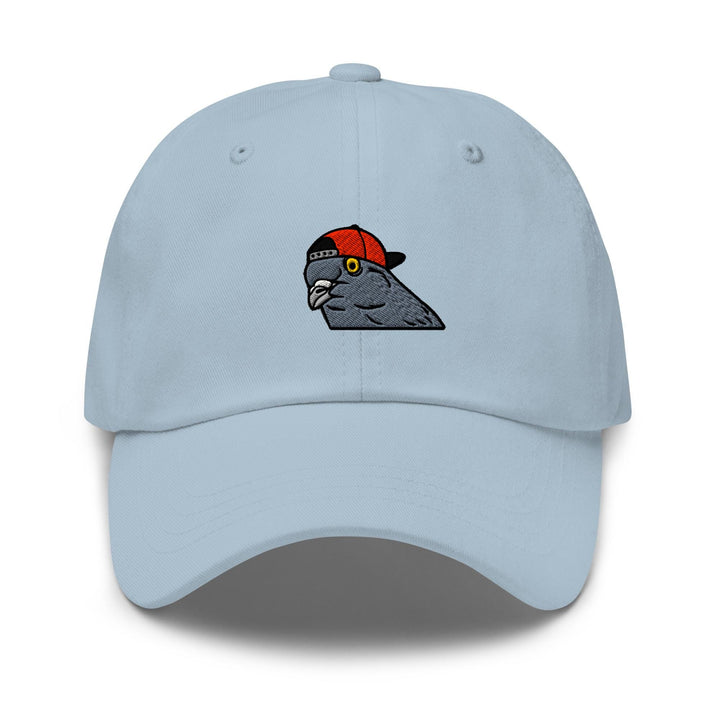 a light blue hat with a bird on it