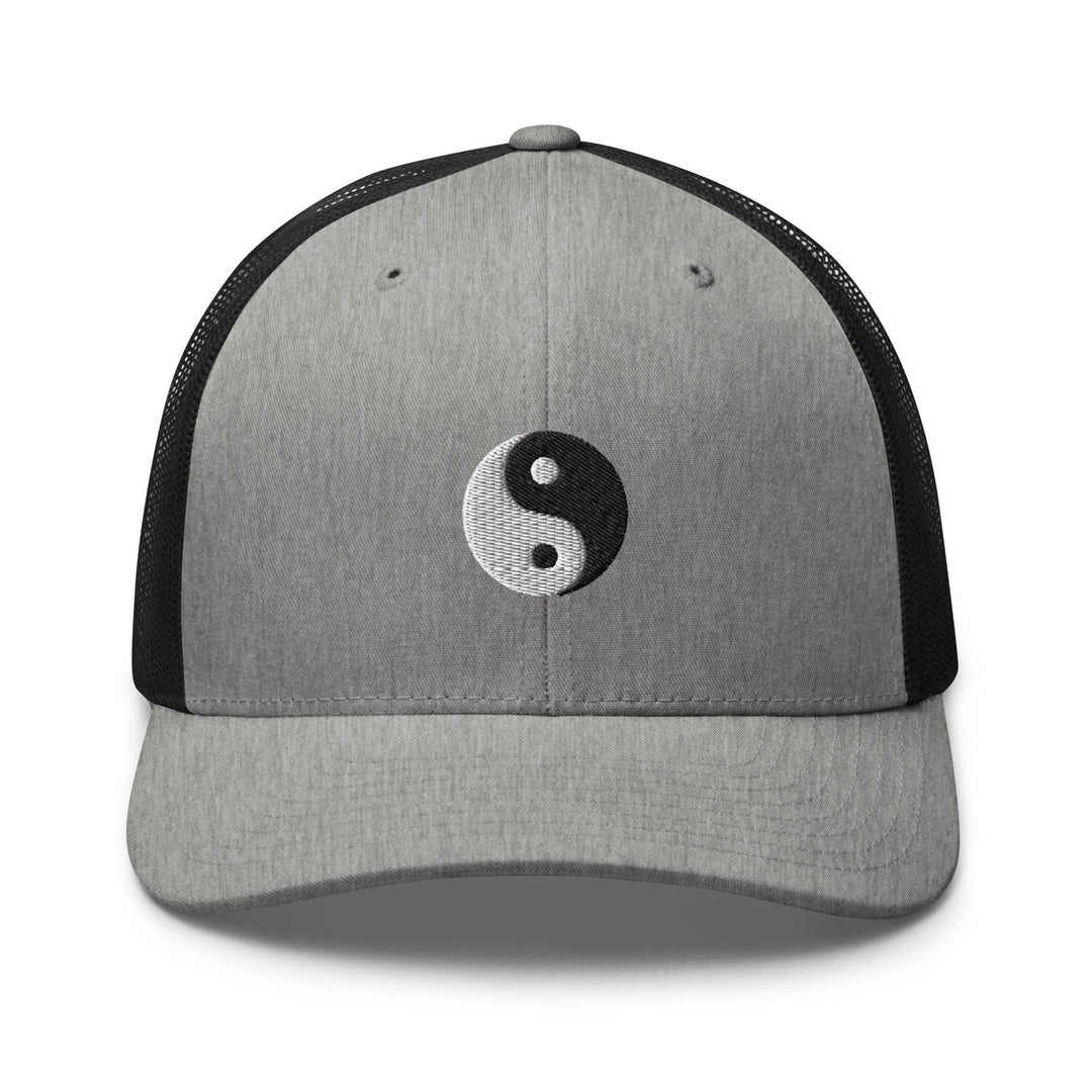 a gray and black hat with a yin symbol on it