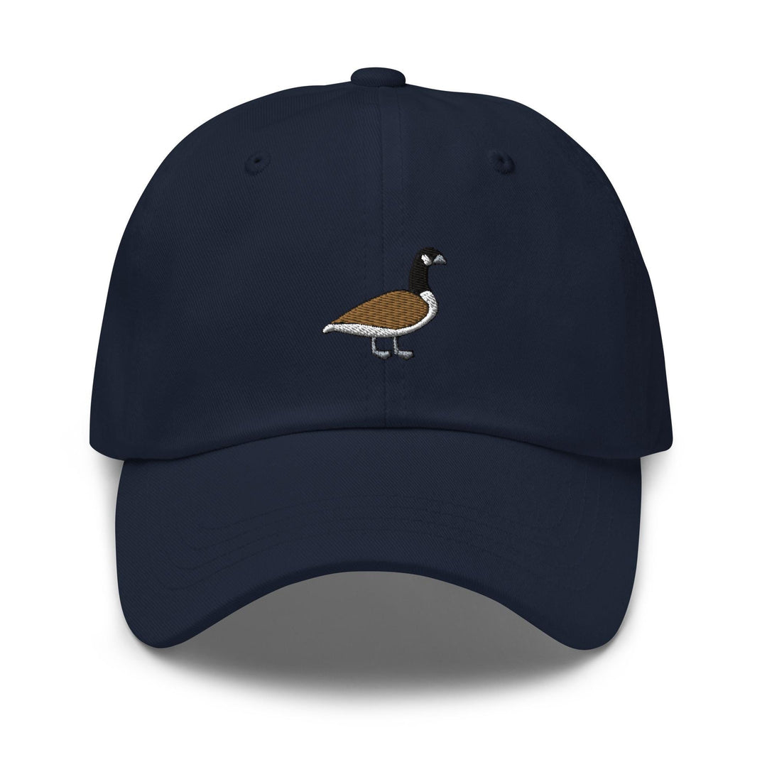 a blue hat with a bird embroidered on it