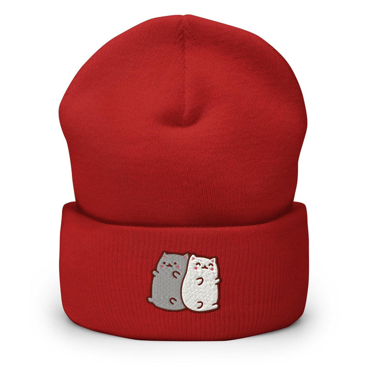 a red hat with two cats on it