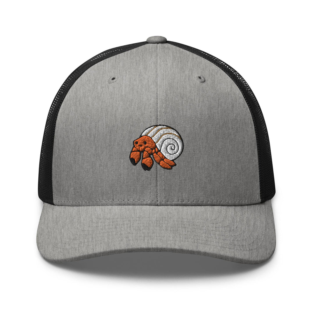 a gray and black trucker hat with an orange fish on it