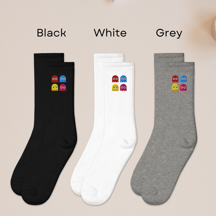 three pairs of black, white, and grey socks