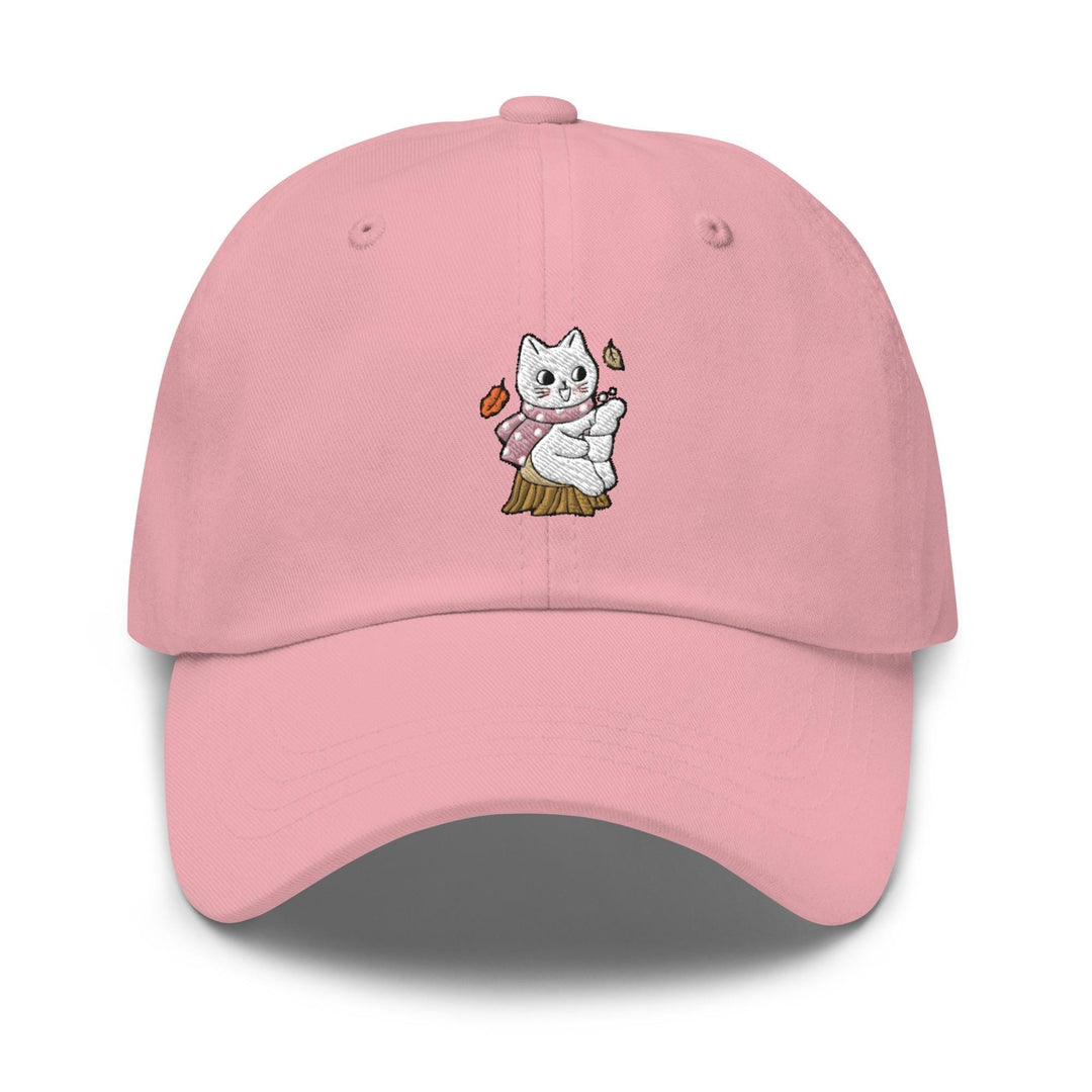 a pink hat with a white cat on it