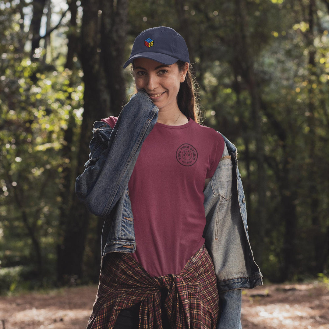 a woman in a red shirt and a jean jacket