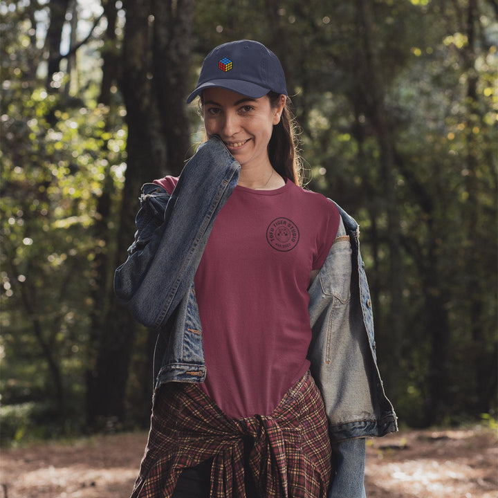 a woman in a red shirt and a jean jacket