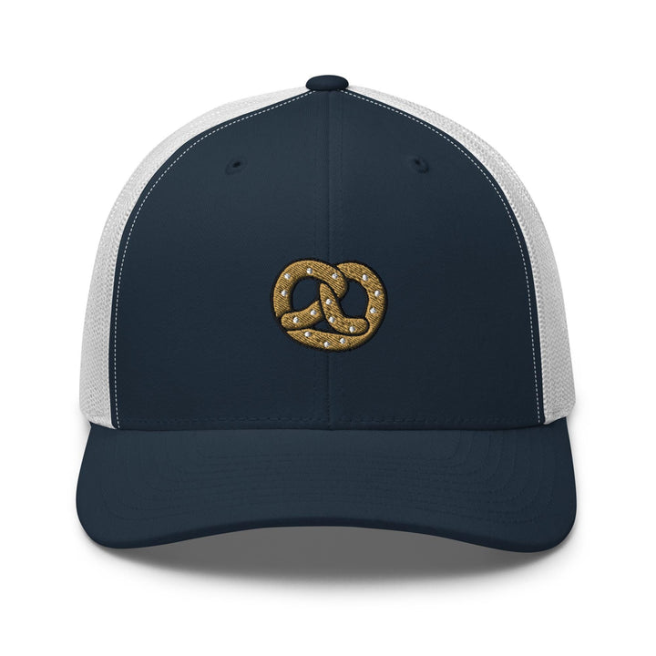 a blue and white trucker hat with a gold knot on the front