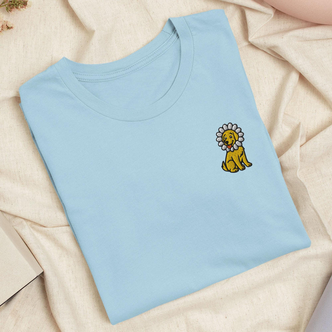 a blue t - shirt with a lion embroidered on it