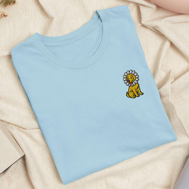 a blue t - shirt with a lion embroidered on it