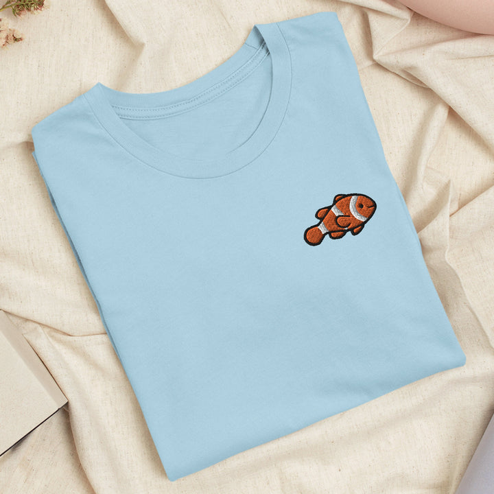 a blue t - shirt with an orange clown on it