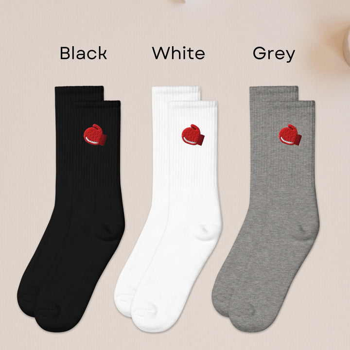 three pairs of black, white, and grey socks