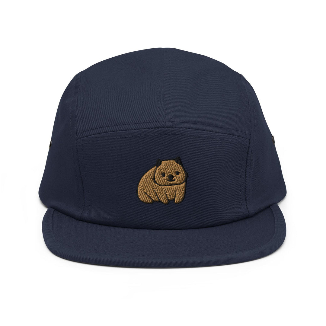 a blue hat with a brown bear embroidered on it