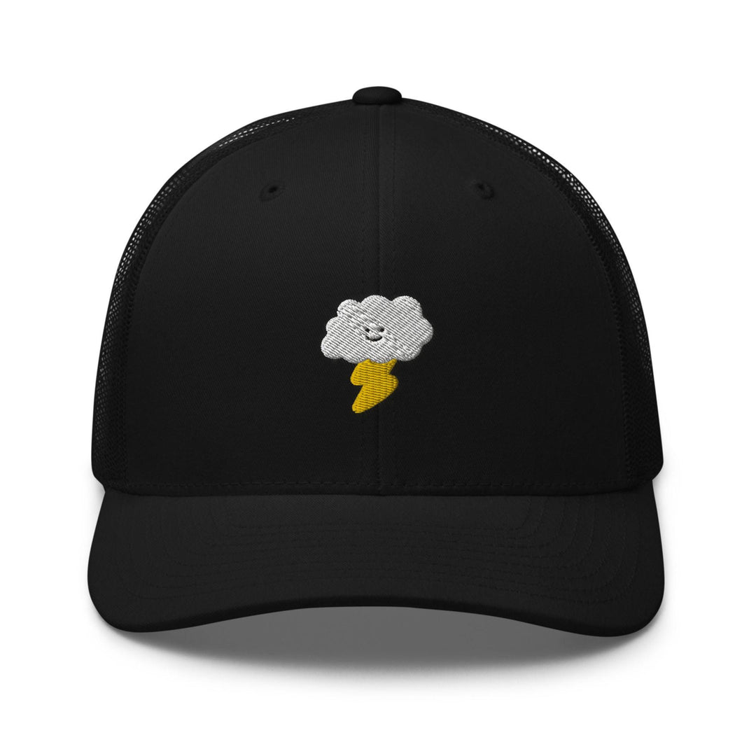 a black trucker hat with a white cloud and a banana on it