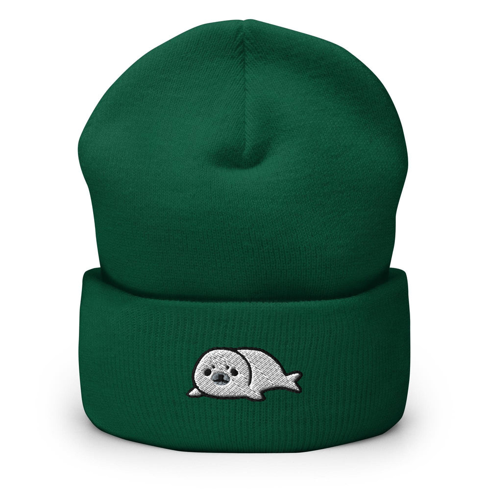 a green beanie with a skull on it