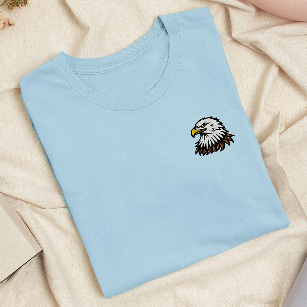 a blue t - shirt with an eagle embroidered on it