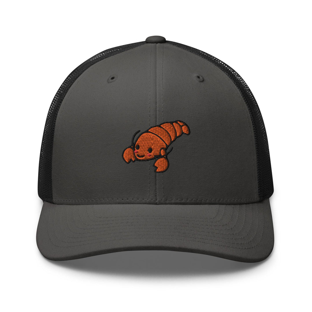 a gray and black trucker hat with an orange fish embroidered on the front