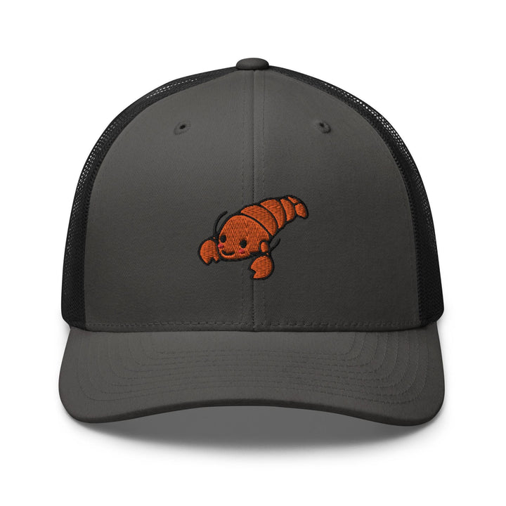 a gray and black trucker hat with an orange fish embroidered on the front
