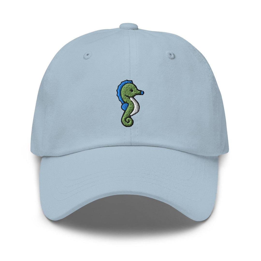 a light blue hat with a seahorse embroidered on the front