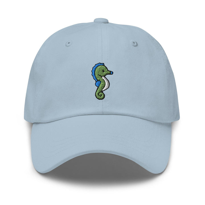 a light blue hat with a seahorse embroidered on the front