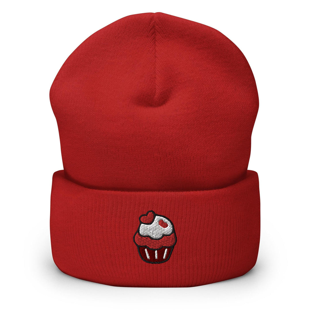 a red beanie with a cupcake embroidered on it